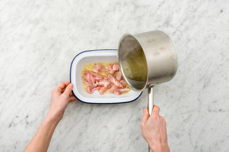 Pour stock over the chicken
