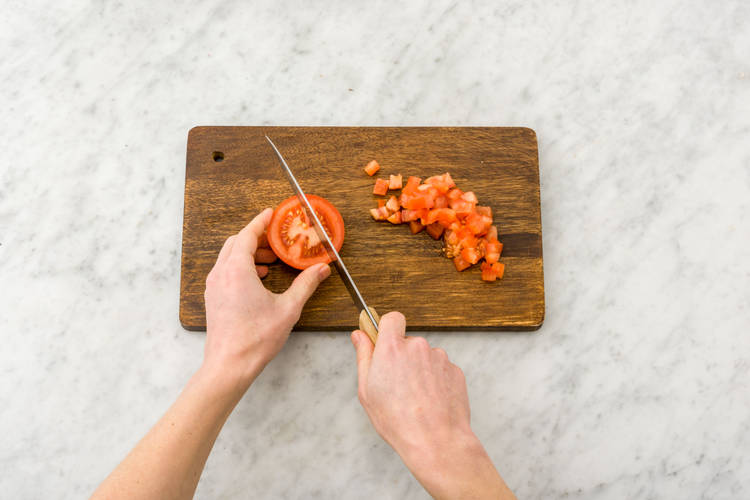 Chop the tomatoes into cubes