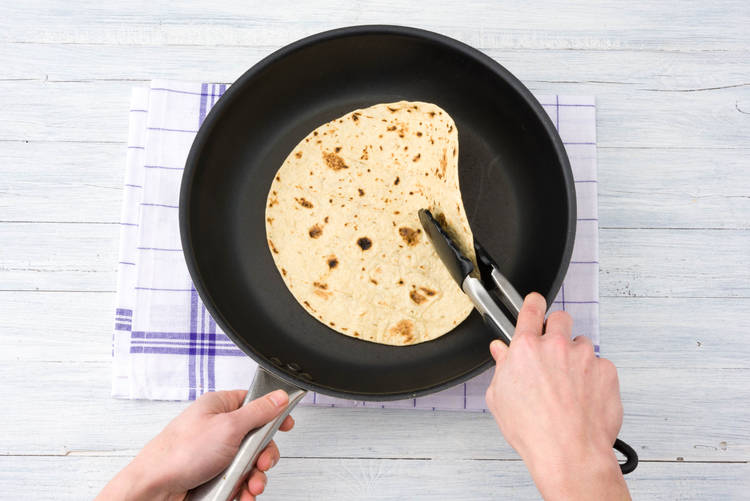 Heat the white flour wraps