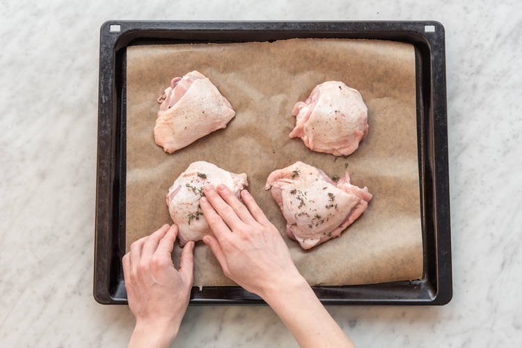Rub the chicken thighs