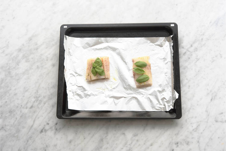 Top the fish with basil