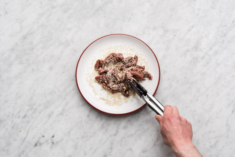 Coat the beef in the sesame seeds