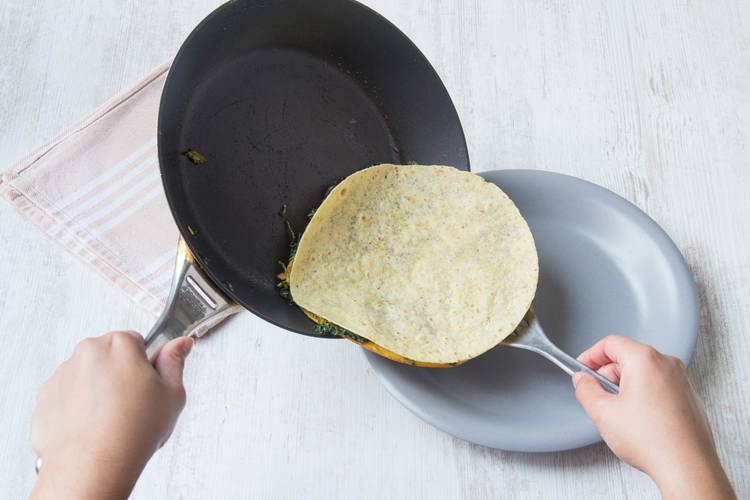 Slide the quesadilla out of the pan