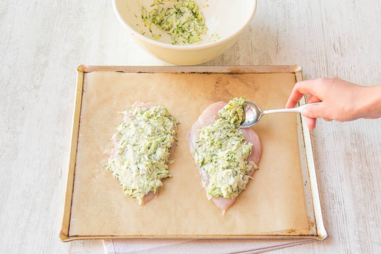 Top the chicken with the courgette mixture