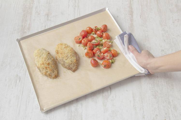 Add tomatoes to baking sheet