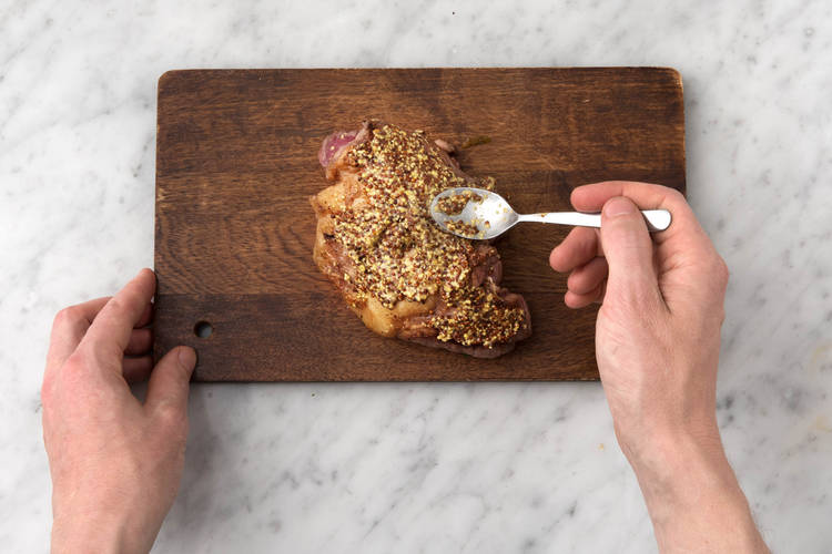 Spoon the mustard over the lamb