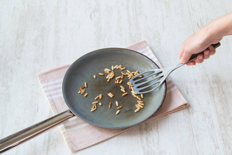 Toast the pine nuts