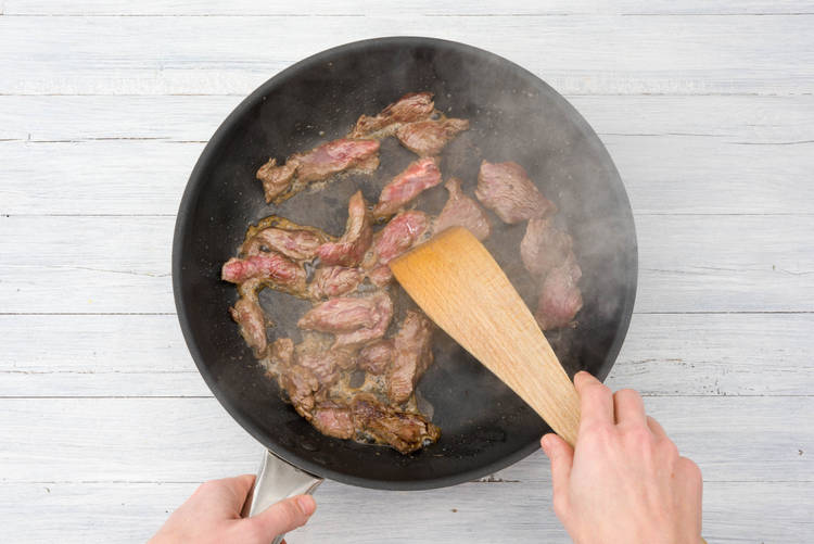 Stir fry the beef strips
