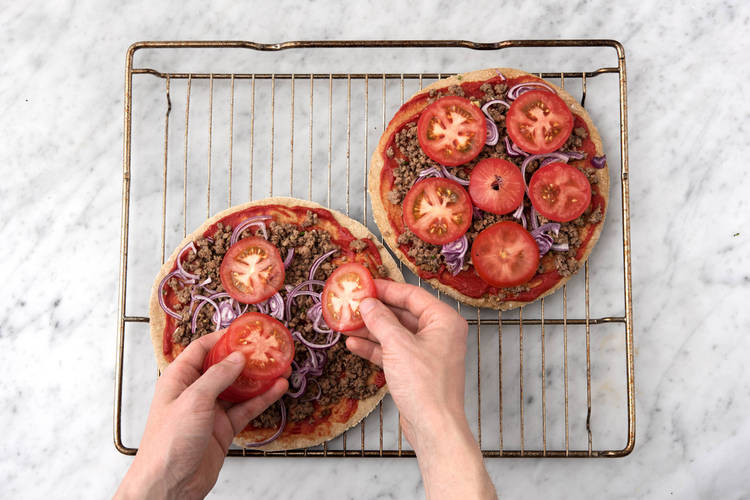 Top the pizza bases