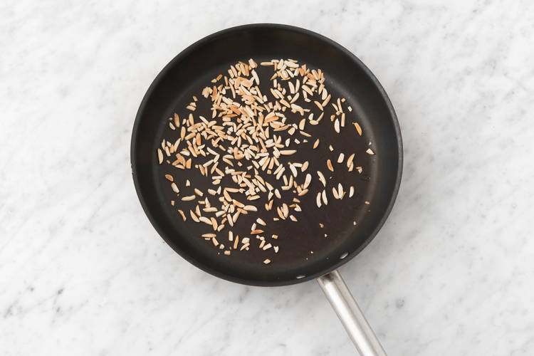 Toast the slivered almonds
