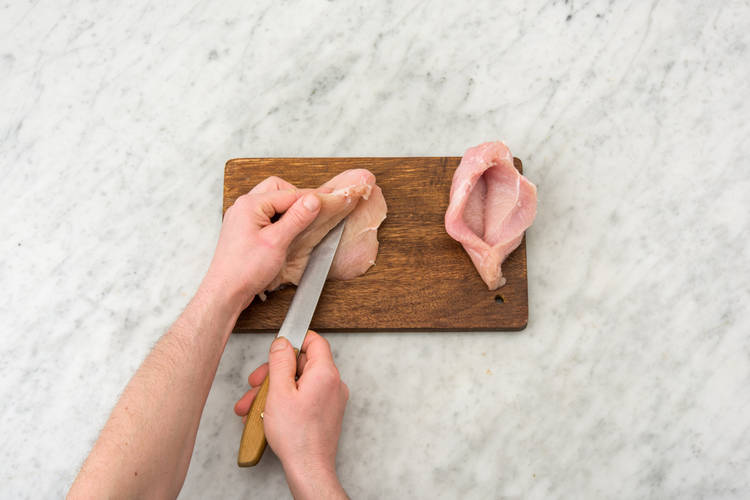 Cut a deep horizontal slit into the side of each chicken breast
