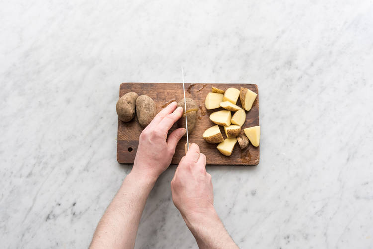 Quarter the potatoes