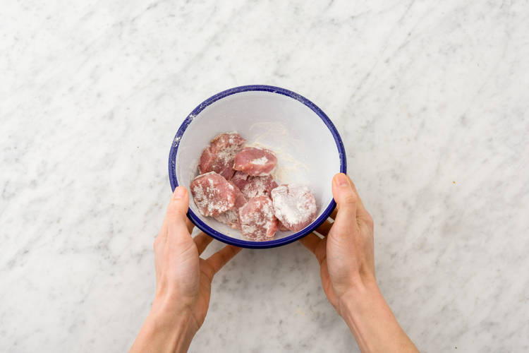 Coat pork in flour.