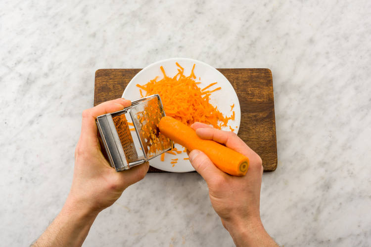 Grate carrot.
