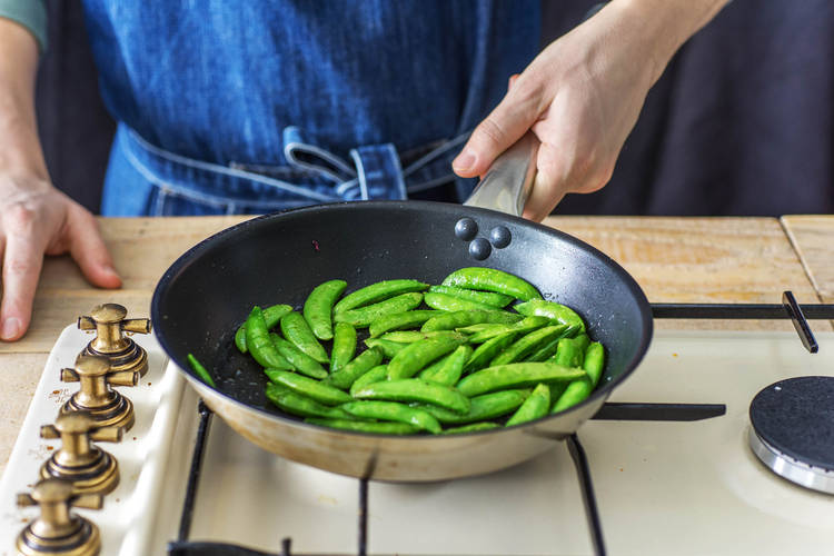Stir fry the sugar snaps