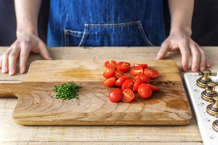 Halve the cherry tomatoes