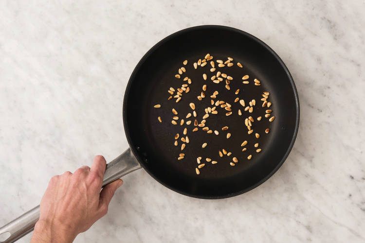 Toast the pine nuts