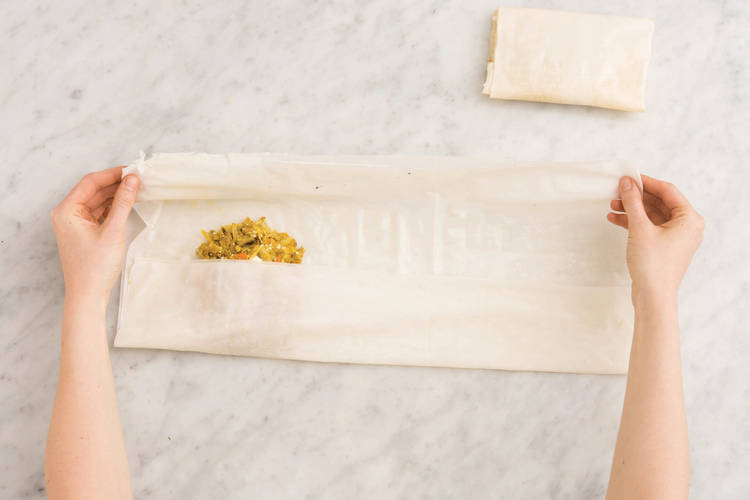 Fold the samosas