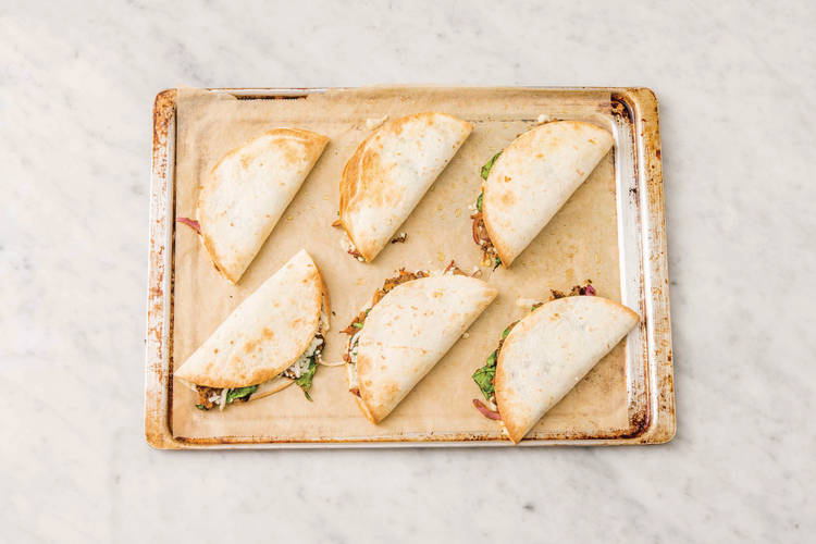 Flip the quesadillas