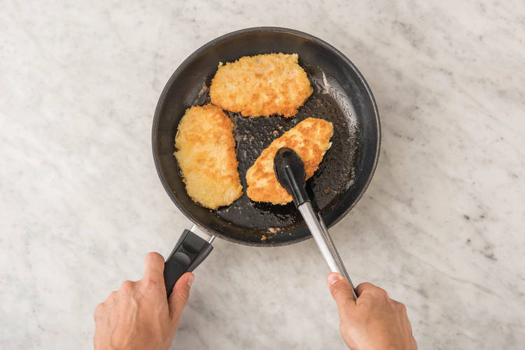 COOK THE CRUMBED SCHNITZELS