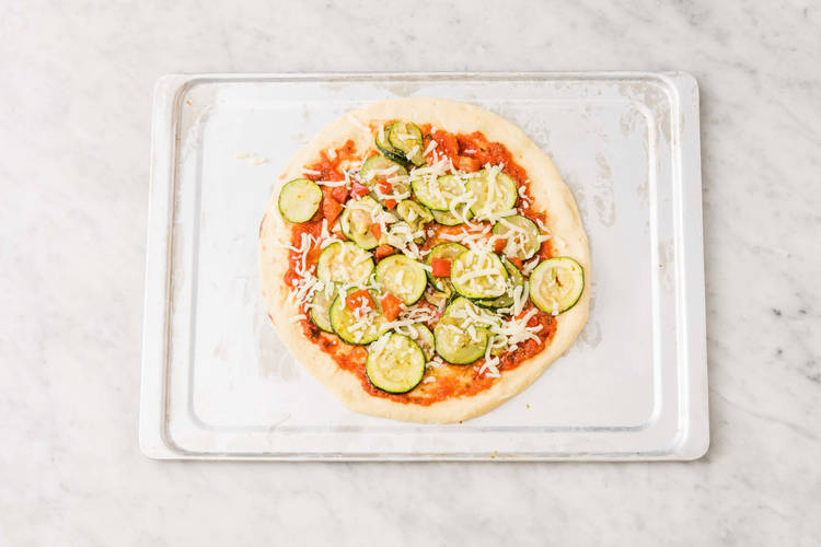 Assemble the pizzas
