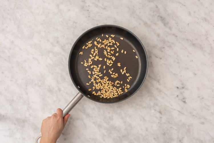Toast the pine nuts