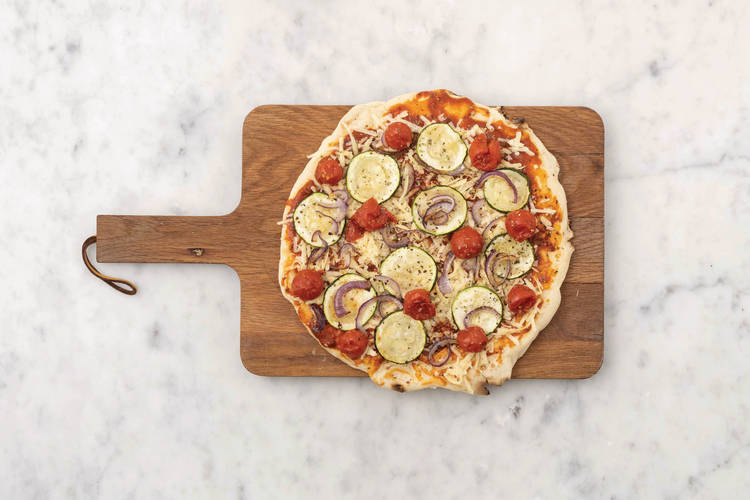 Assemble the pizzas