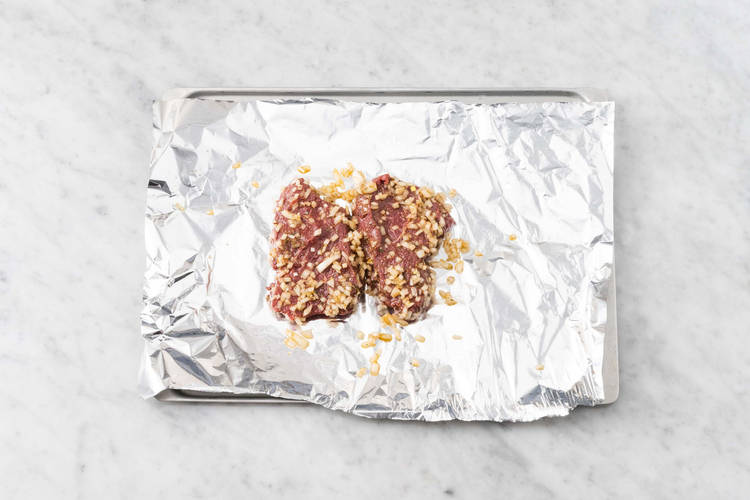 Broil steak and onions