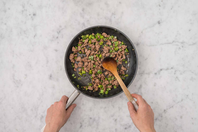 Cook beef and poblanos