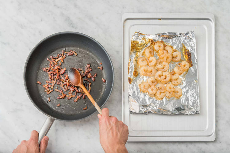 Cook bacon and shrimp
