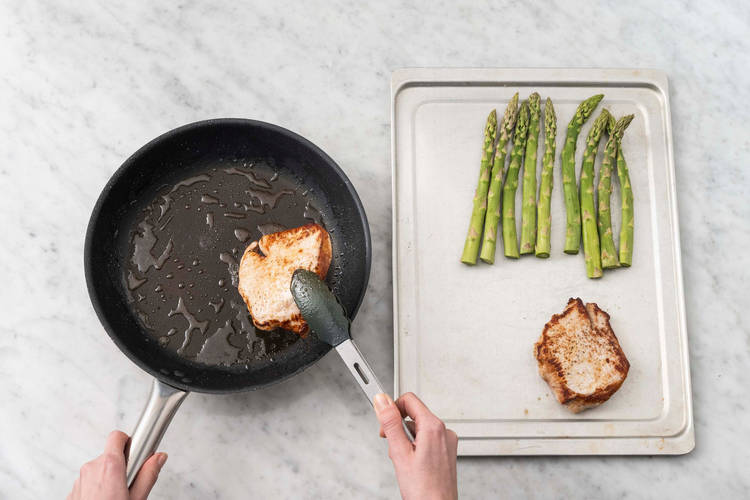 Cook pork and asparagus