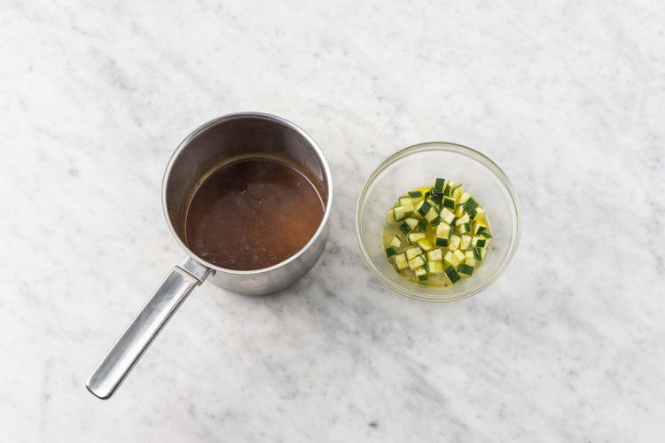 Marinate cucumbers and warm curry sauce