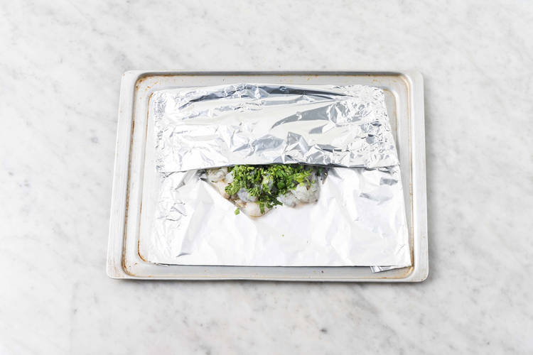 Season steaks and shrimp