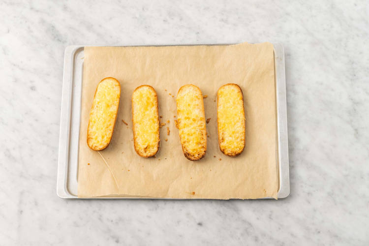 Toast rolls and melt cheese