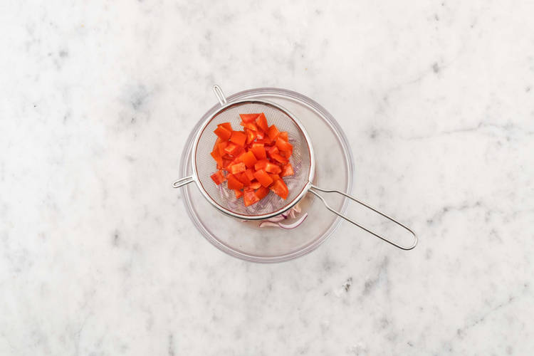 Salt tomatoes and marinate onions