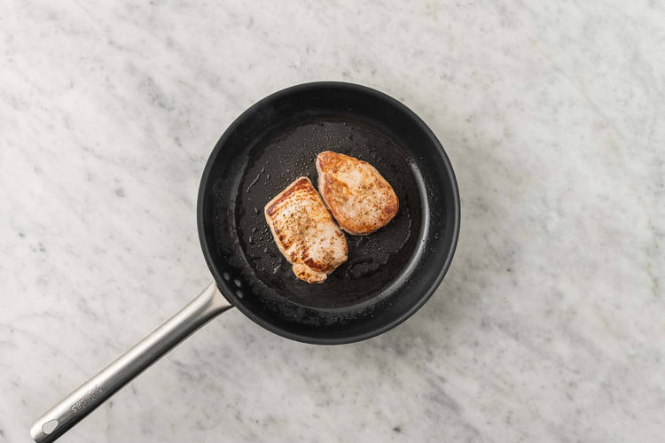 Sear pork chops and mix sauce