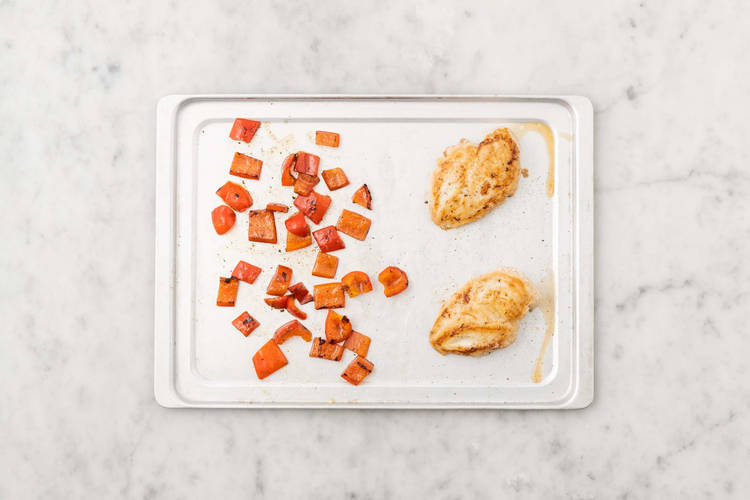 Cook chicken and peppers