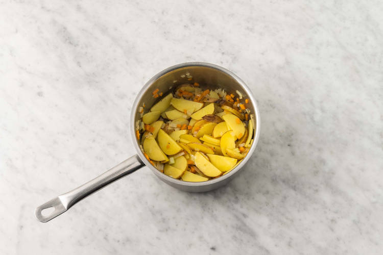 Cook potatoes and veggies