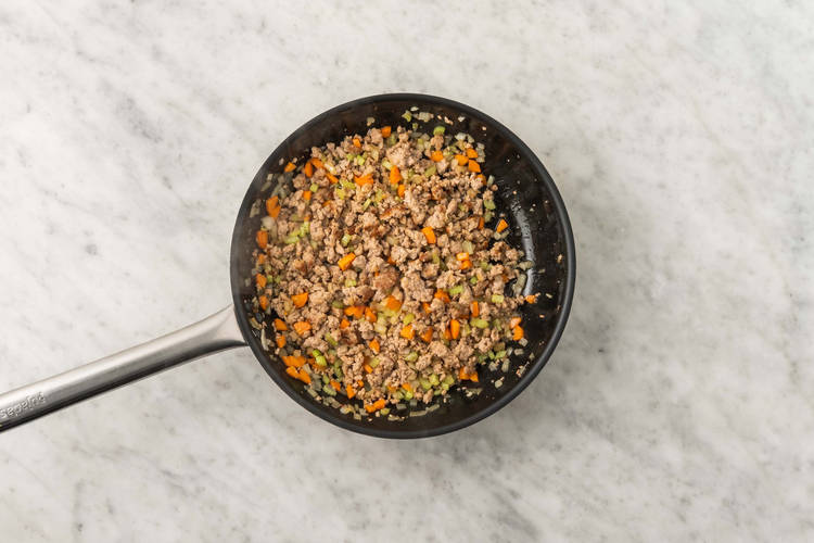 Cook sausage and mirepoix