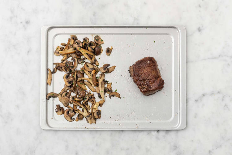 Cook mushrooms and finish steak