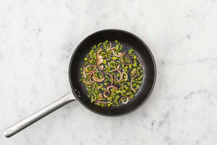 Cook poblanos and onions