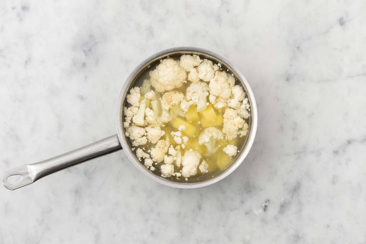 Cook potatoes and cauliflower