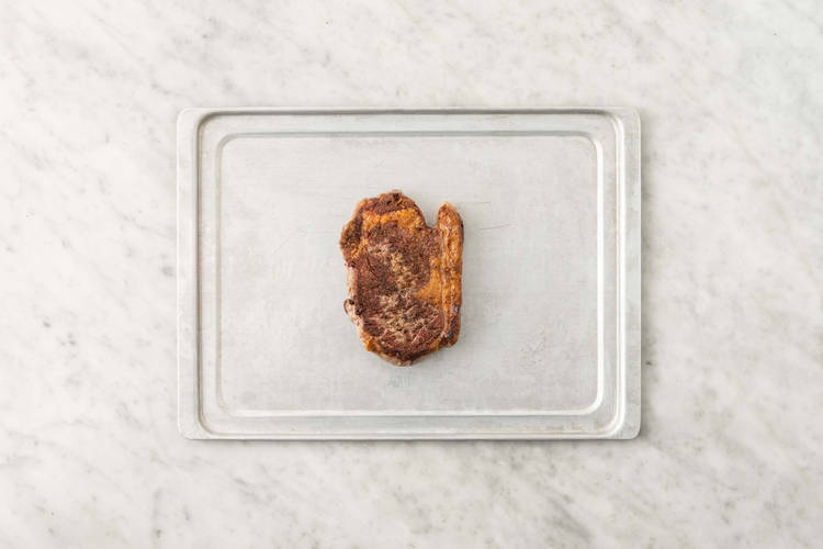 Cook steak and finish potatoes