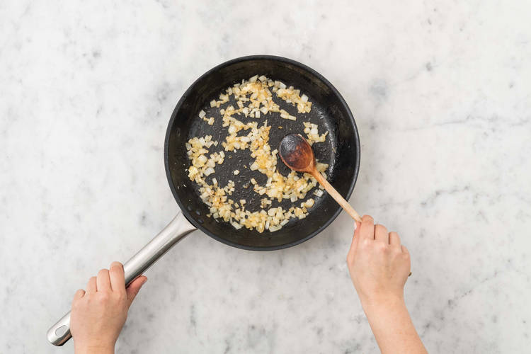 Cook harissa-spiced onions