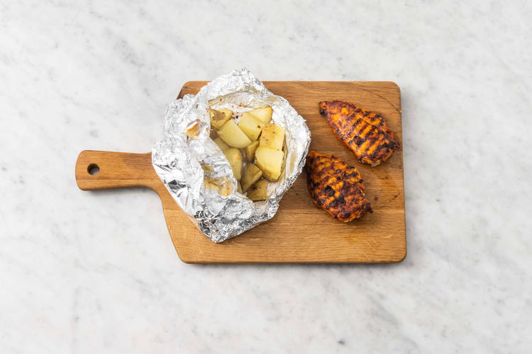 Grill potatoes and chicken
