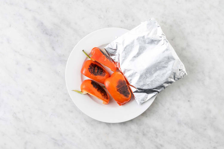 Cook peppers and warm tortillas