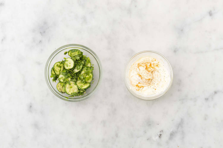Make spiced sour cream and marinate cucumbers