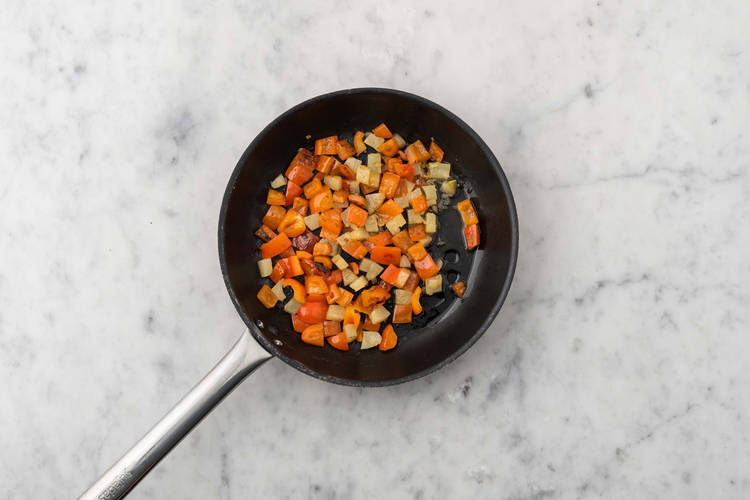 Cook peppers and pineapple