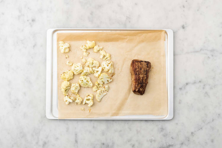 Cook pork and cauliflower