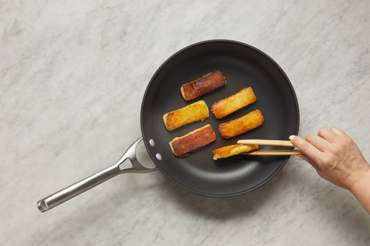 Cook Grilling Cheese